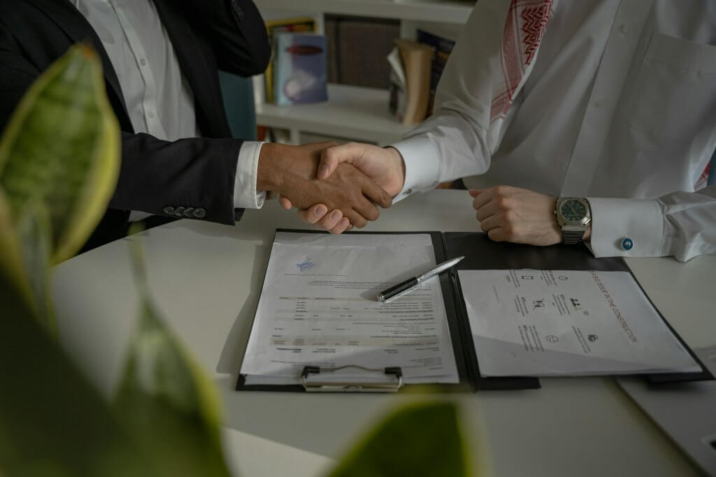 Handshake over a signed business contract
