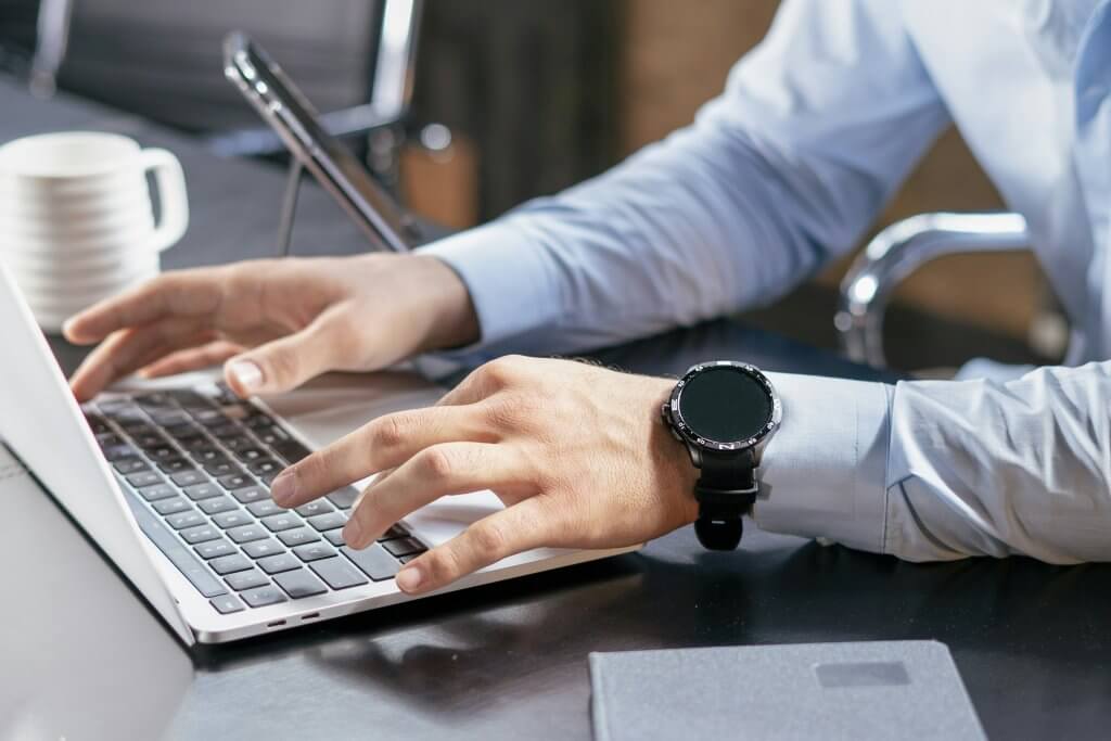 Entrepreneur working on a laptop to run a remote company